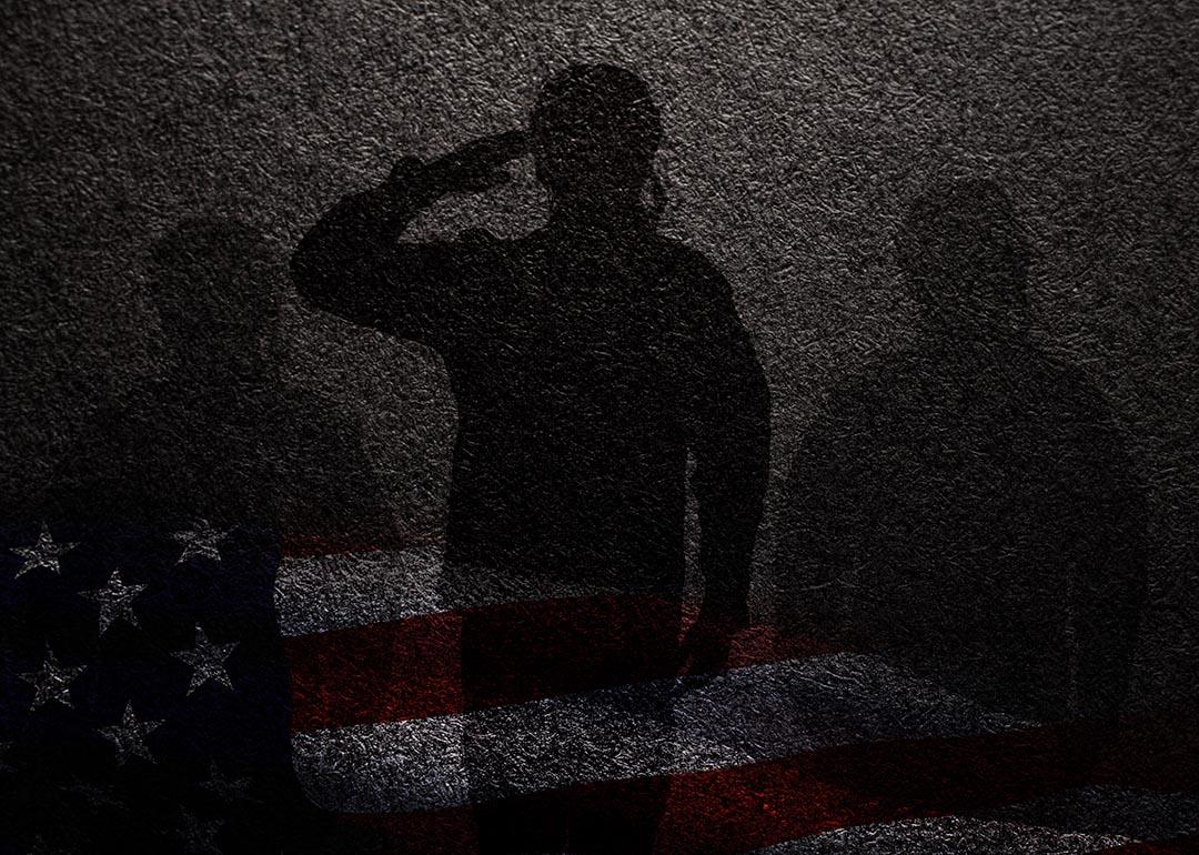 Concept of military sexual assault illustrated by three silhouettes against a dark wall, faint overlay of American flag beneath.