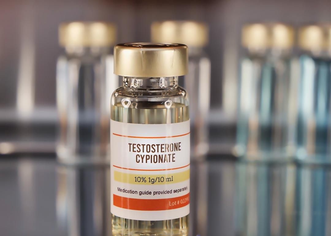 Vial of Testosterone Cypionate in foreground with other vials visible in background. 