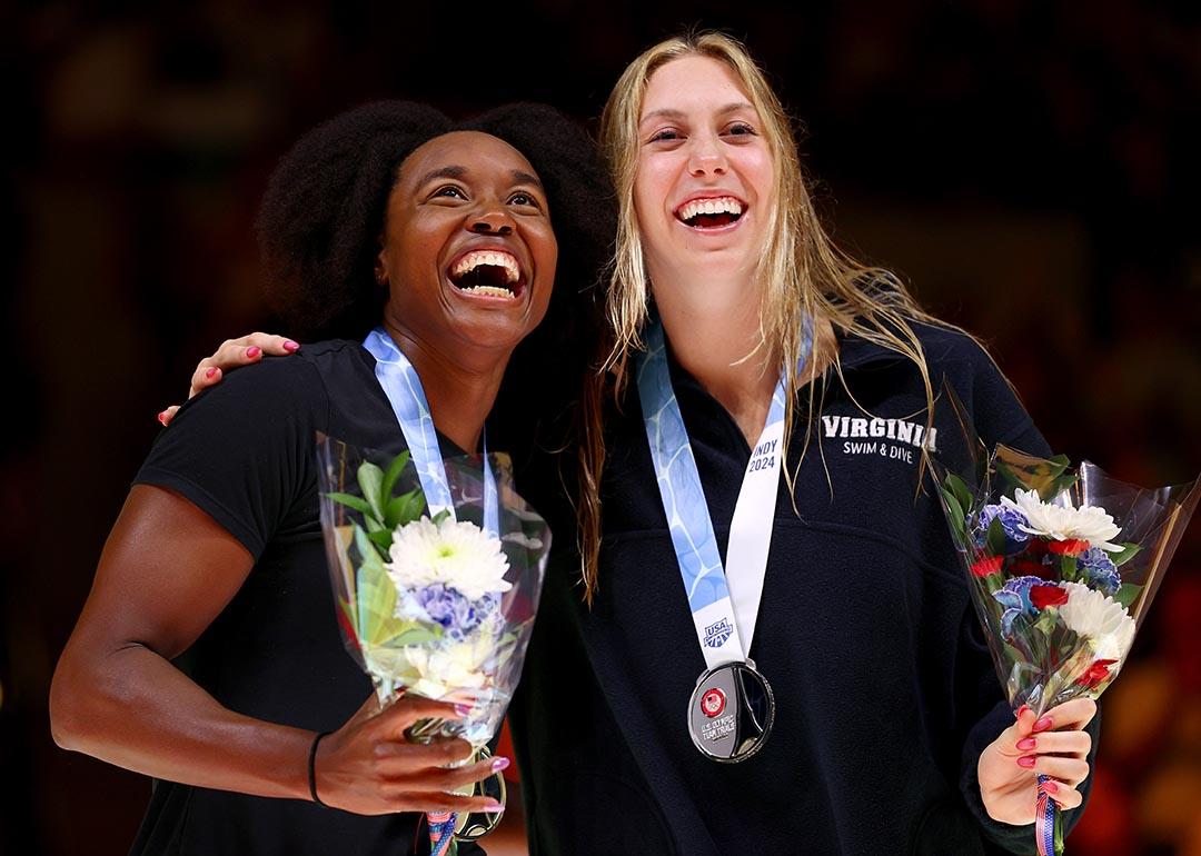 Simone Manuel and Gretchen Walsh react during the medal ceremony for the Women's 50m freestyle final at the 2024 U.S. Olympic Team Swimming Trials.