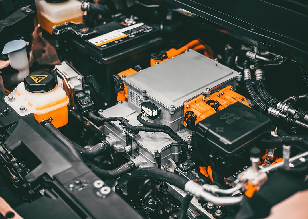 View of electric vehicle engine under car hood.