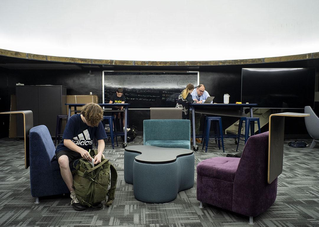 Students complete work during a finance class held in the planetarium inside of Valley High School in New Kensington, PA