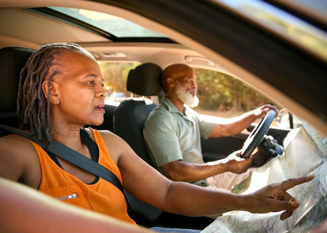 Confused senior couple lost while driving.