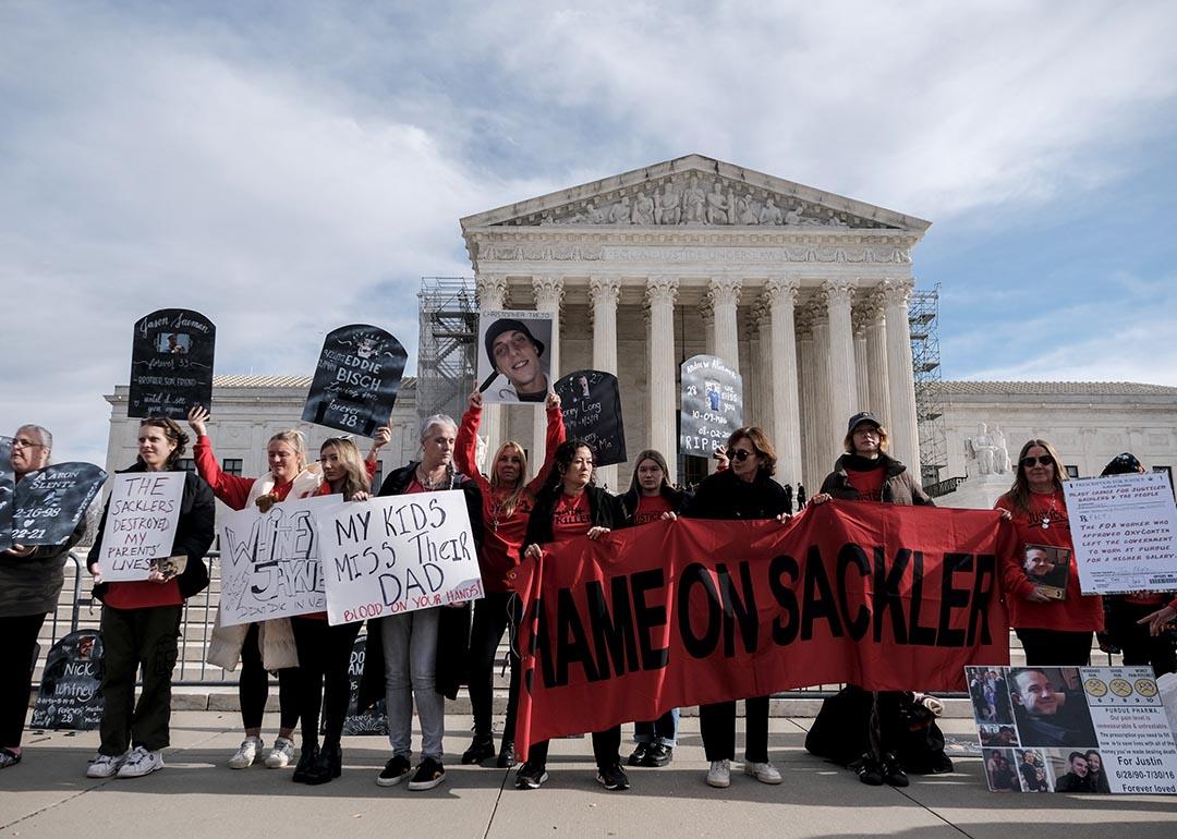 Protesters gather outside of the U.S. Supreme Court on December 4, 2023 in response a nationwide settlement with Purdue Pharma, the manufacturer of OxyContin.