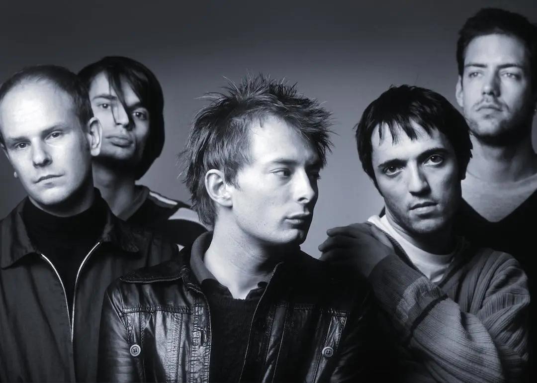 Black and white studio portrait of Radiohead—Phil Selway, Jonny Greenwood, Thom Yorke, Colin Greenwood, and Ed O'Brien—in 1995.