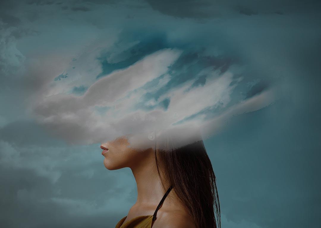 Image of a woman whose head is illustrated with clouds.