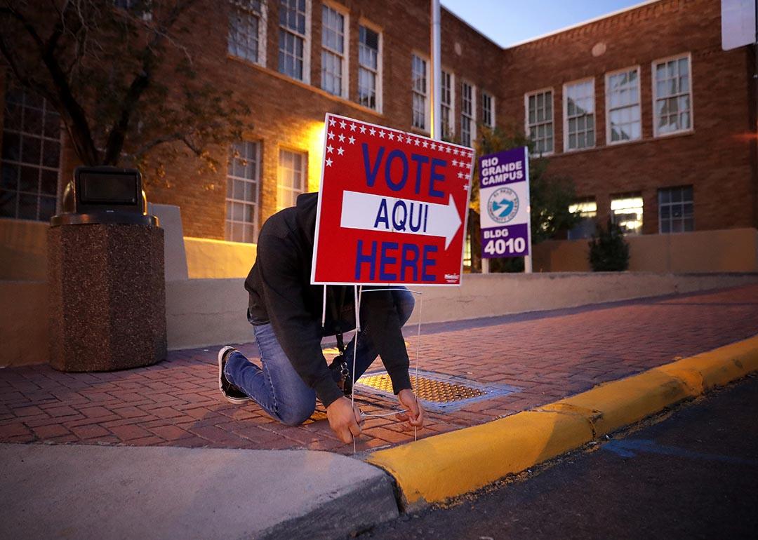 Pollworkers put out signs in El Paso, TX for the midterm election in 2018. 