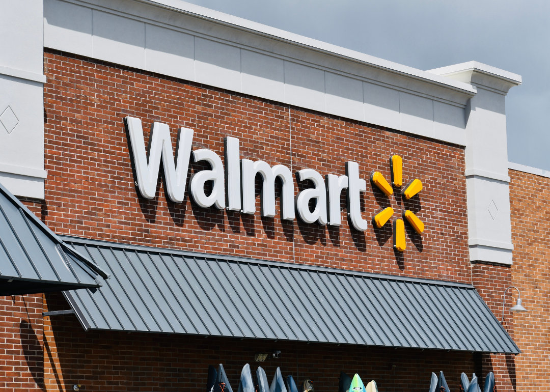 Exterior view of a Walmart store, with the logo against a brick wall 