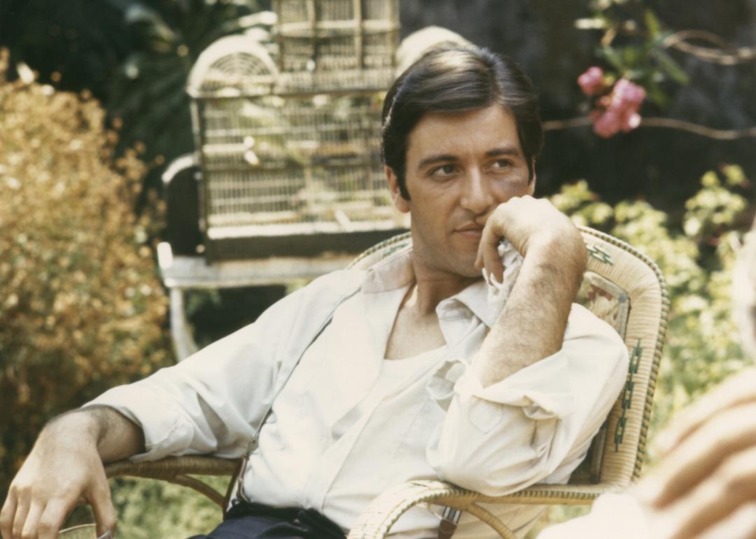 Al Pacino relaxes in garden as Michael Corleone in a scene from the 1972 drama 'The Godfather.' 