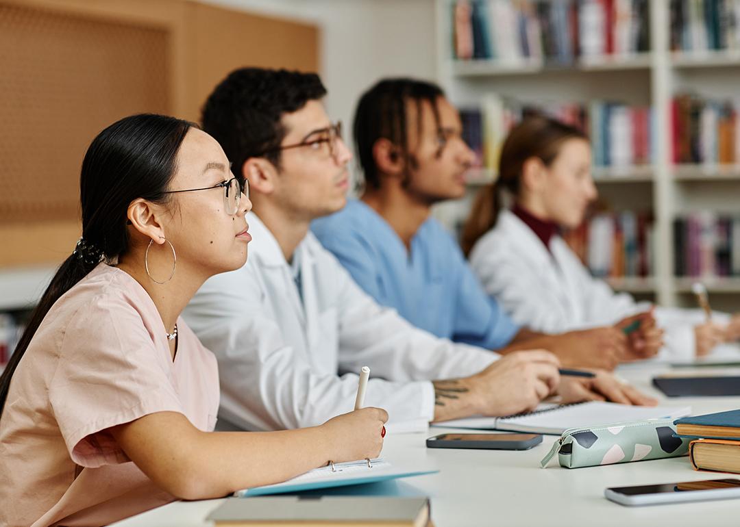 A group of medical students listening during a lecture.