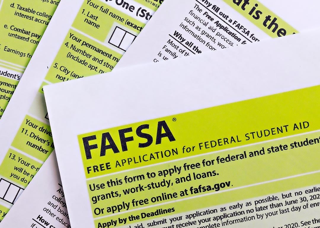 Overhead view of stacks of paper FAFSA forms.