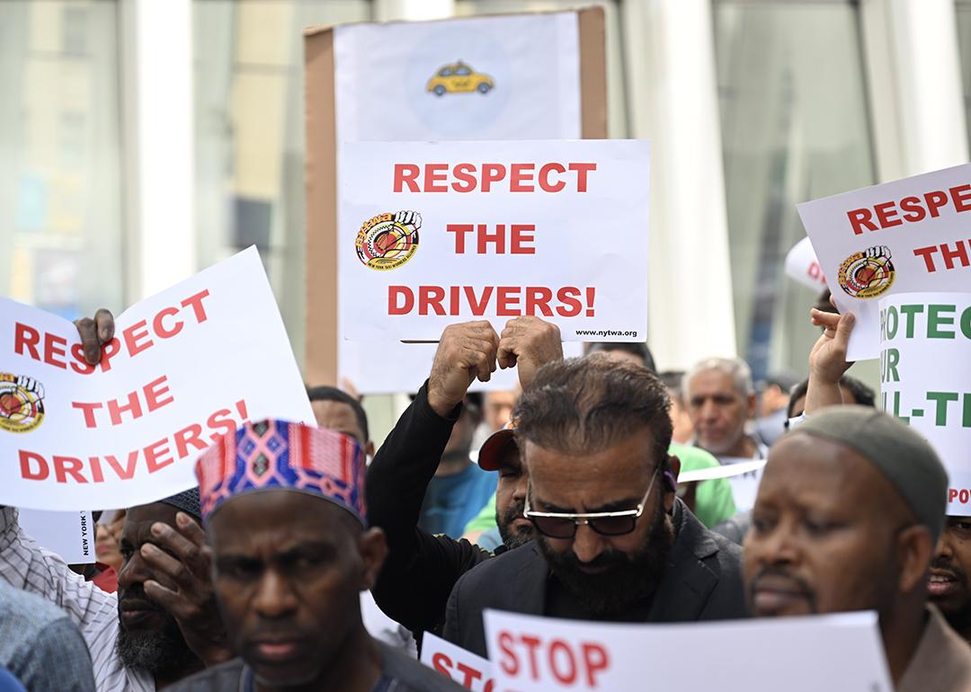 Uber and Lyft drivers protest against pay cuts, longer hours and stressful shifts at the company's New York headquarters on June 12, 2024 in New York.