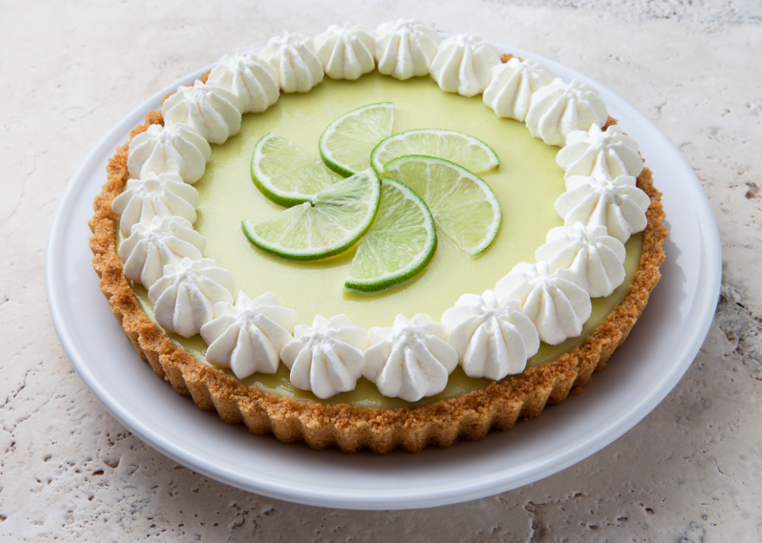 Key lime pie with a graham cracker crust and whipped cream