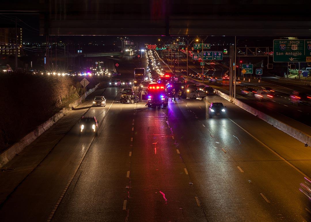  Major traffic accident with multiple cars involved, at junction of Loop 1604 with I-10 in San Antonio, TX with firefighters, police and ambulance at the scene.