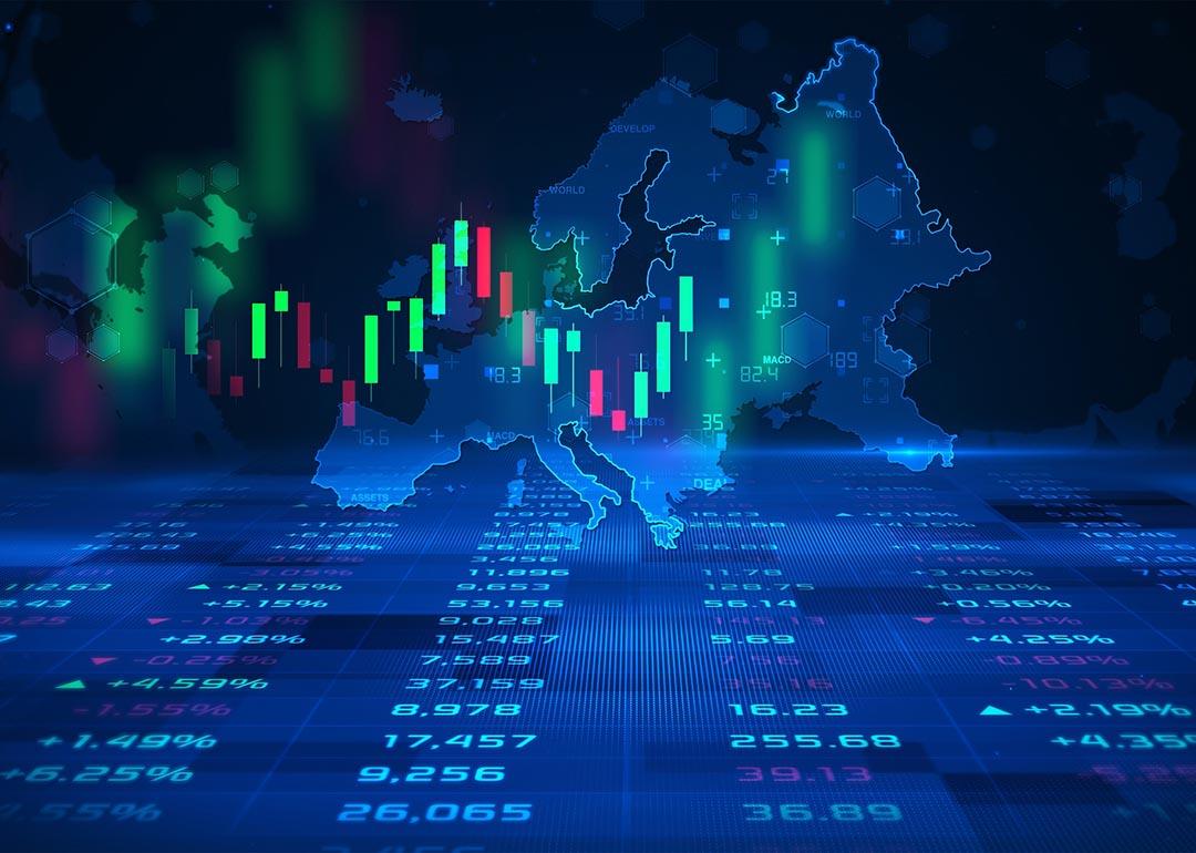 Concept of futures trading and European stock market illustrated by candlestick charts superimposed on a map of Europe.