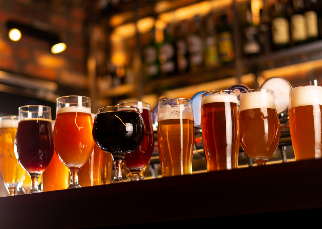 Different types of beer on a bar.