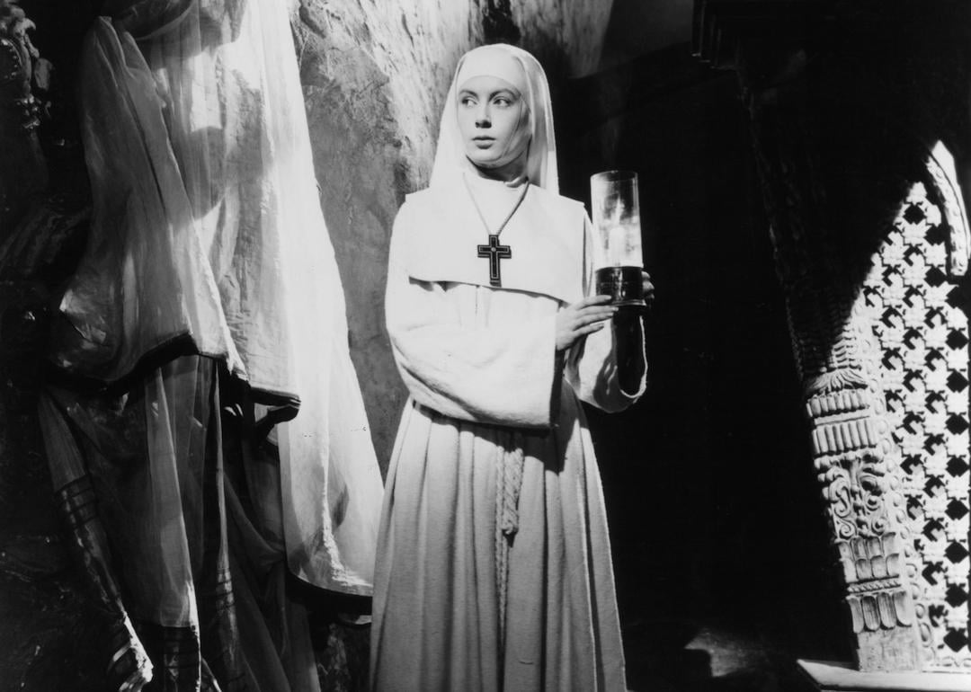 Actor Deborah Kerr holds a candle in a scene from the 1947 film 'Black Narcissus.'