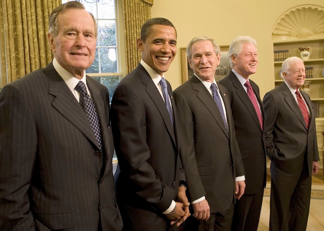 Former Presidents George H.W. Bush, Barack Obama, George W. Bush, Bill Clinton, and Jimmy Carter pose together in the Oval Office on Jan. 7, 2009 at the White House.