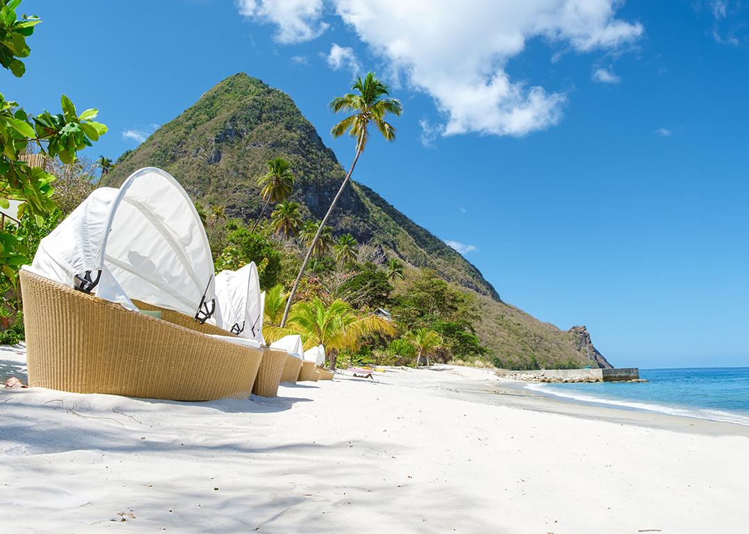 A row of luxury chairs on the Sugar Beach in Saint Lucia island.