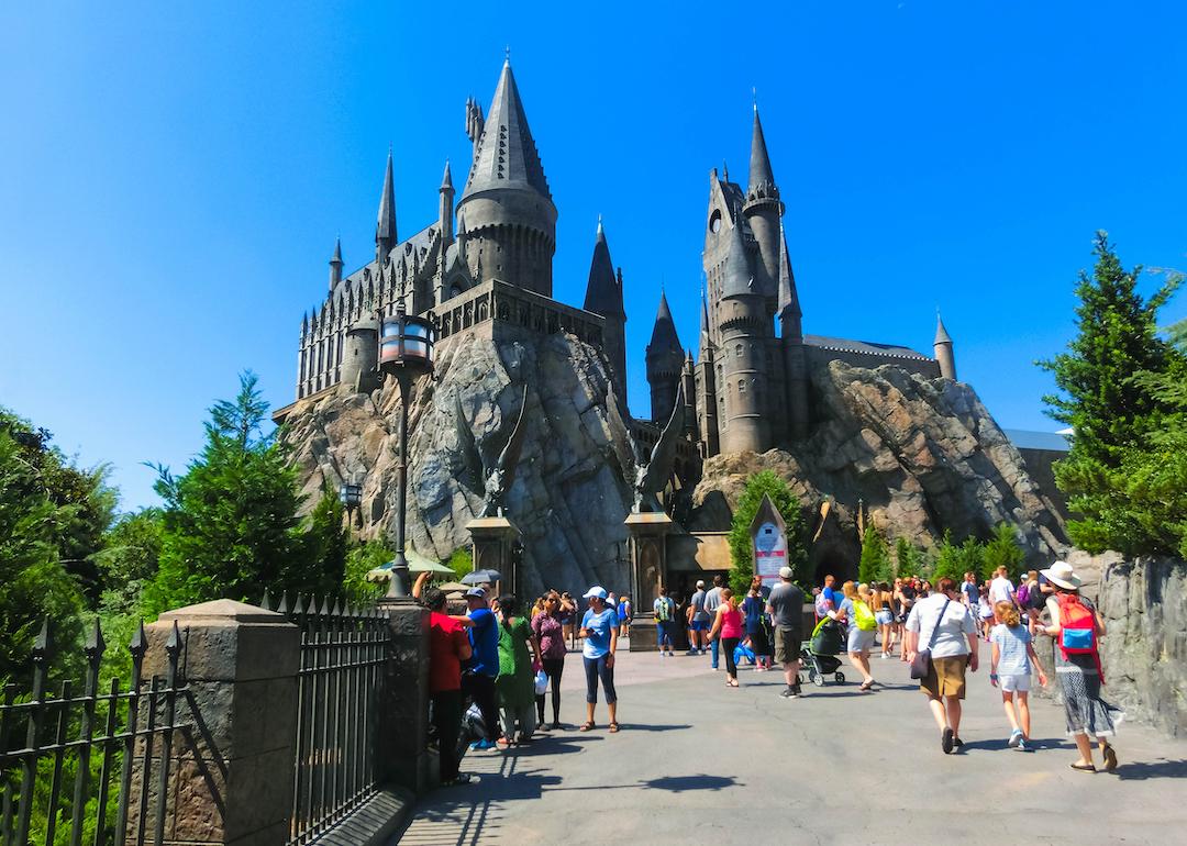 People entering Hogwarts Castle at The Wizarding World of Harry Potter at Universal Studios Orlando.