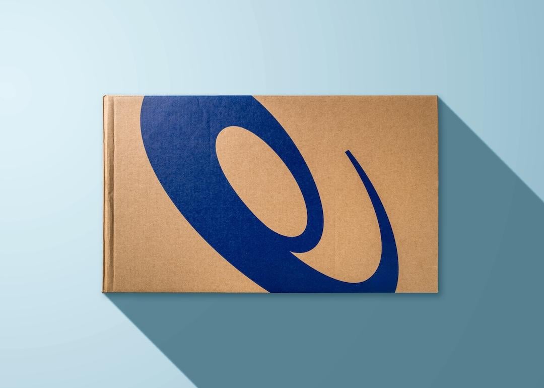 Sport shoe box with Asics logo printed on a blue background.