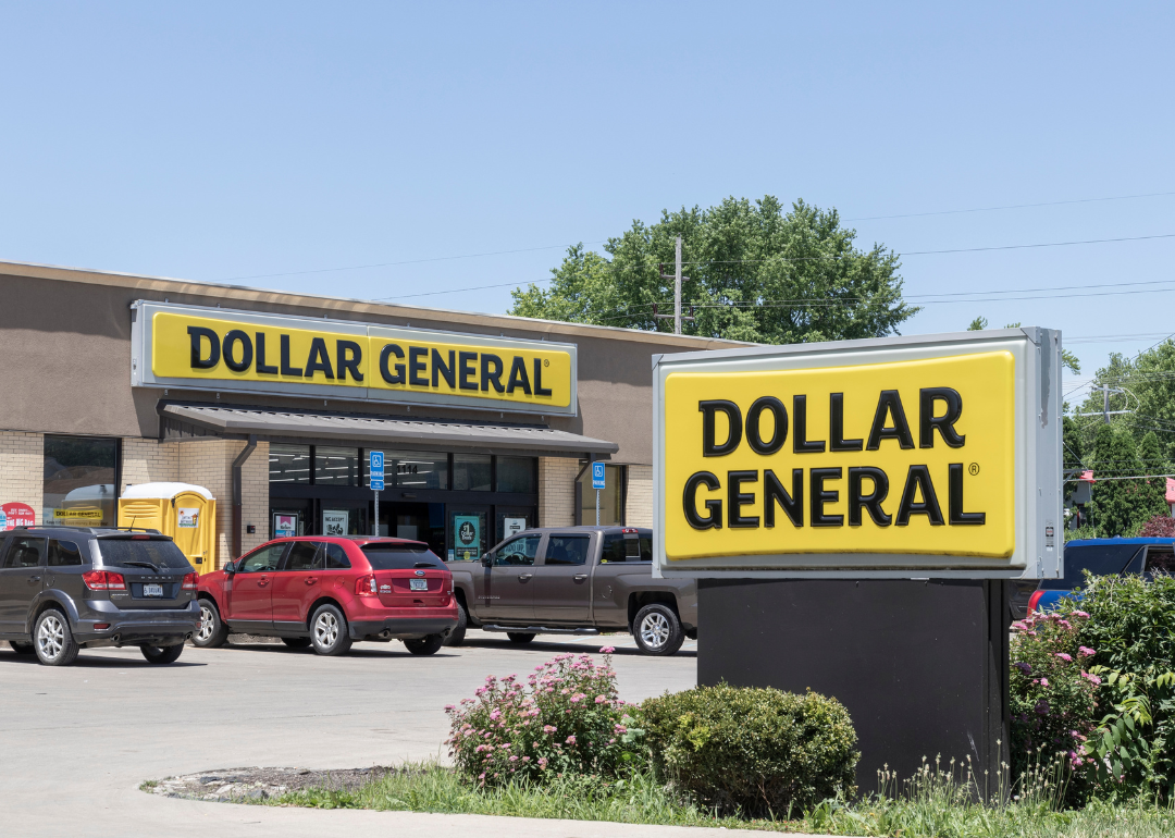 The exterior of a Dollar General store with cars parked outside