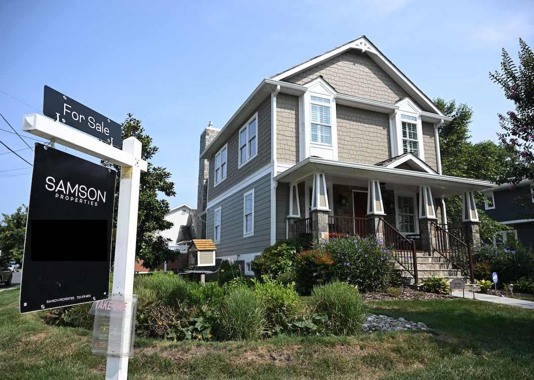 A 'for sale' sign in the front yard of a craftsman home in Arlington, Virginia, in 2023.