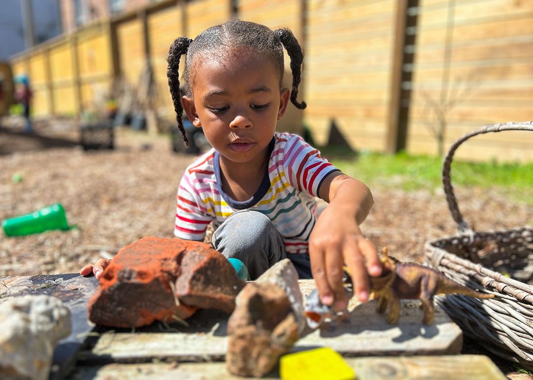 A 3-year-old boy plays in an outdoor classroom at Early Partners, a child care center in New Orleans that participates in City Seats, a tax-funded program that pays for child care.