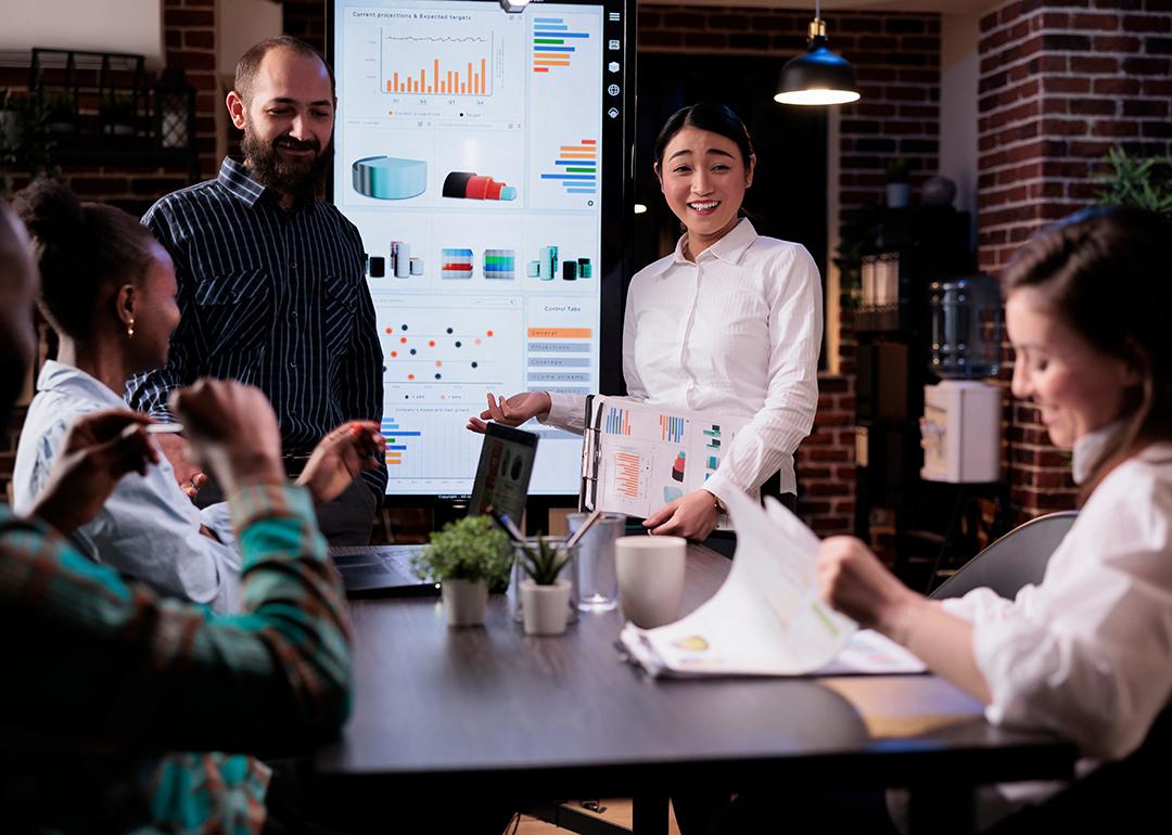 A business group discussing results in a meeting.