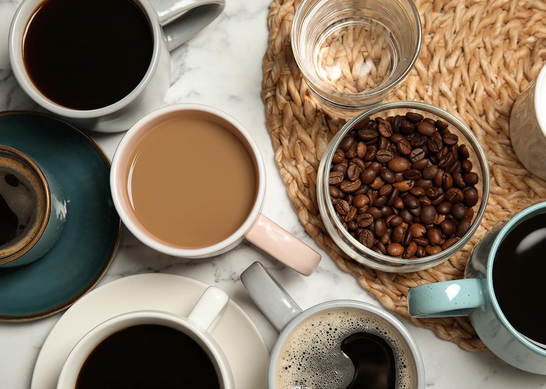 A flatlay of cups of different types of coffee and tea.