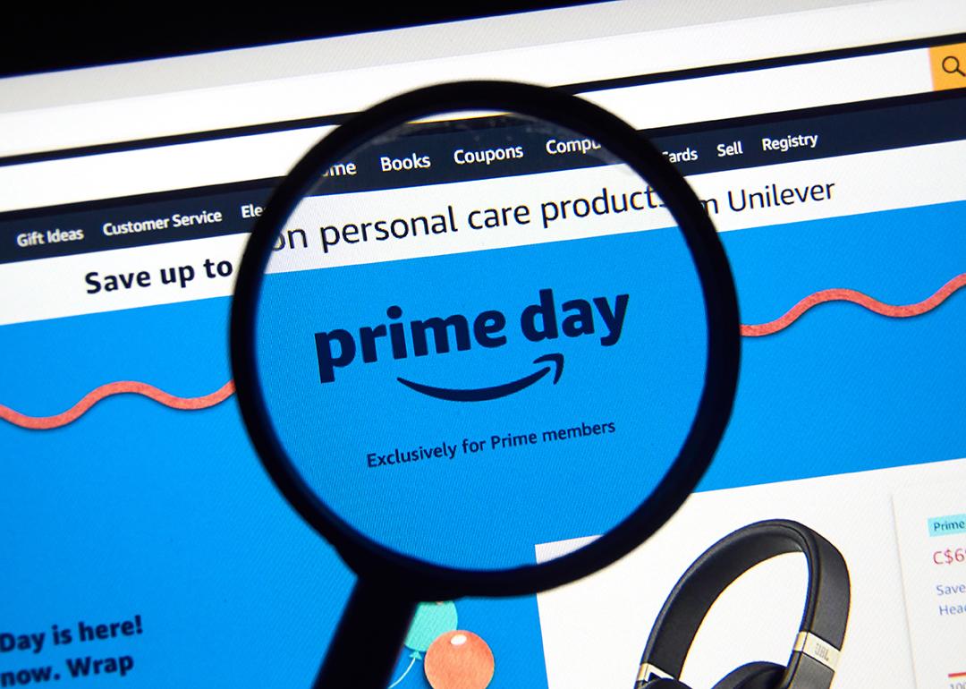 Browsing Amazon Prime Day on a laptop screen under a magnifying screen.