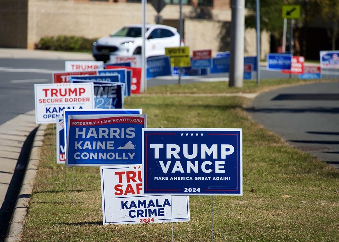 Campaign signs placed on a median lawn for presidential candidates in Fairfax, VA.