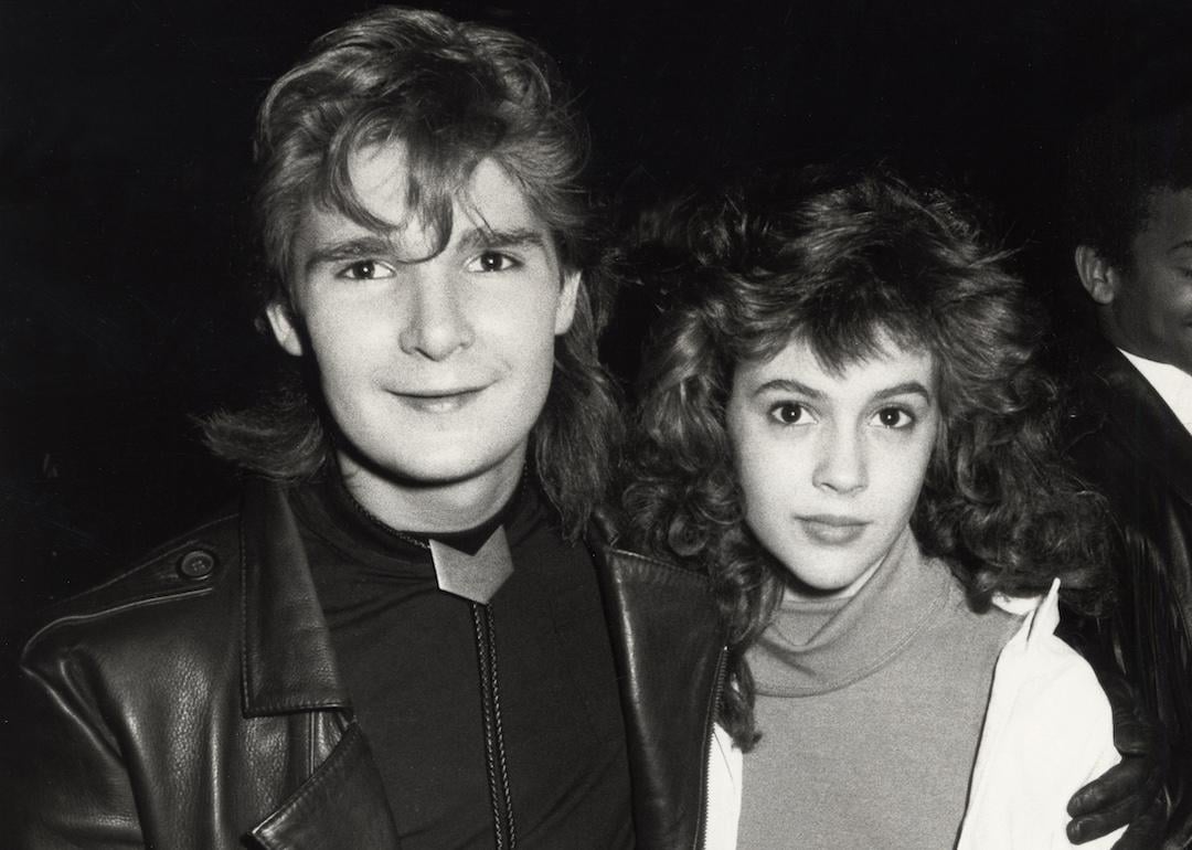 Actors Corey Feldman and Alyssa Milano during the 1987 American Music Awards in Los Angeles.