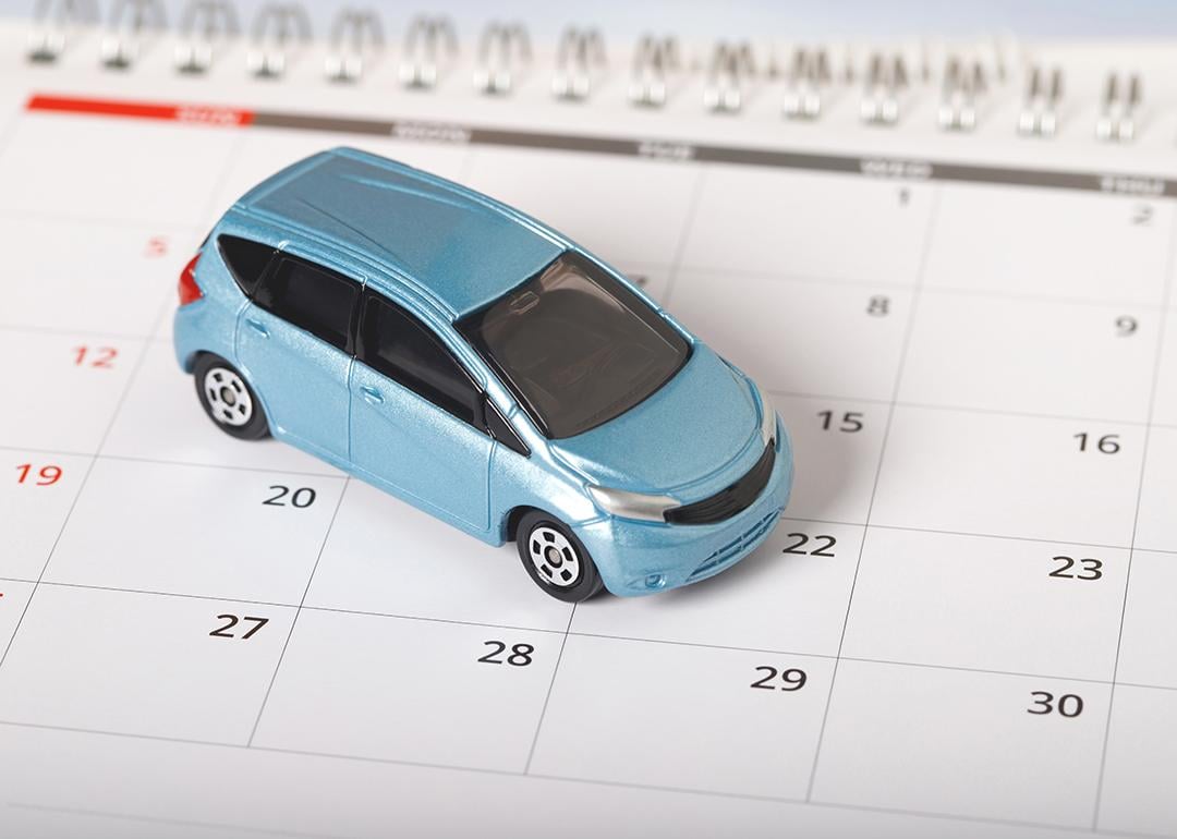 A car figure on top of a calendar.