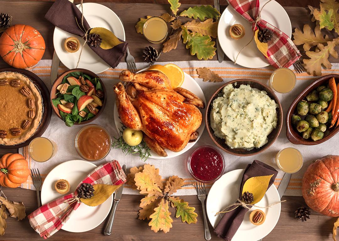 A traditional homemade Thanksgiving feast with autumnal decor.