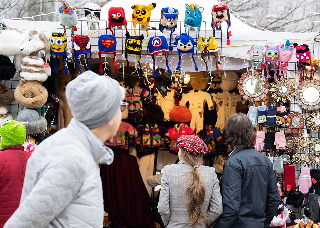 People shopping for Christmas related gifts in an annual downtown market in Washington, DC during the holidays.