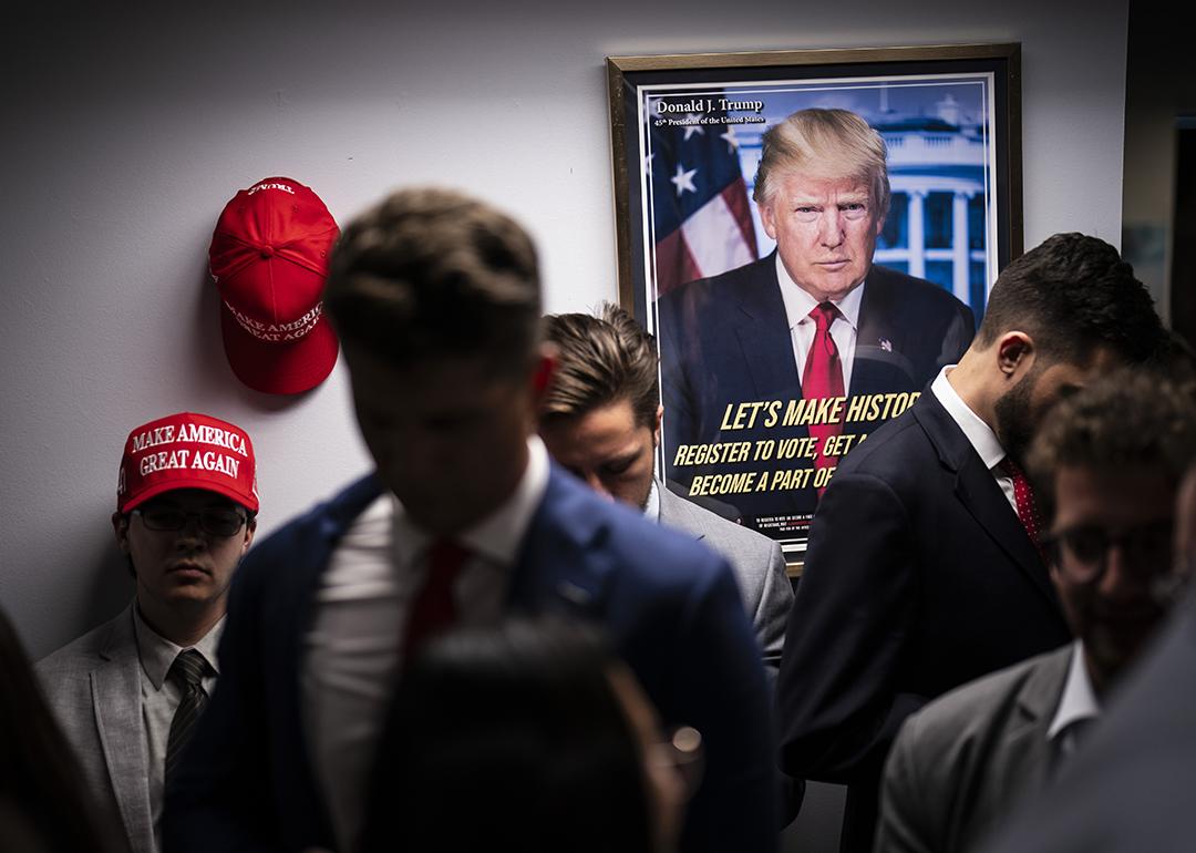 Staff gathering around in a Trump campaign headquarters.