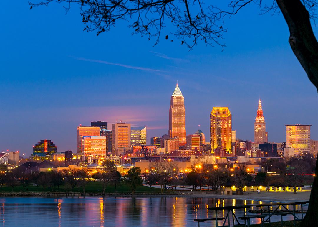 City downtown view of Cleveland, Ohio as it lights up during sunset.