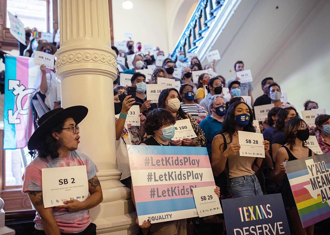 LGBTQ rights supporters gather at the Texas State Capitol to protest state Republican-led efforts to pass legislation that would restrict the participation of transgender student athletes in 2021.