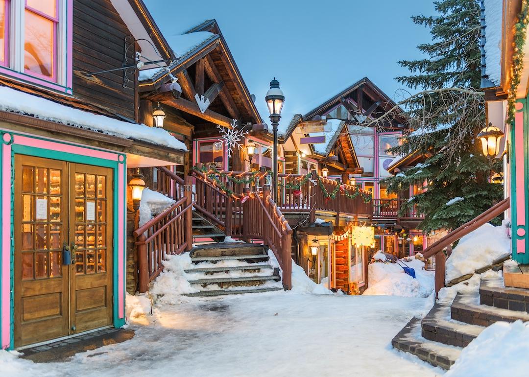 Streets decorated for Christmas in Breckenridge, Colorado, at night.