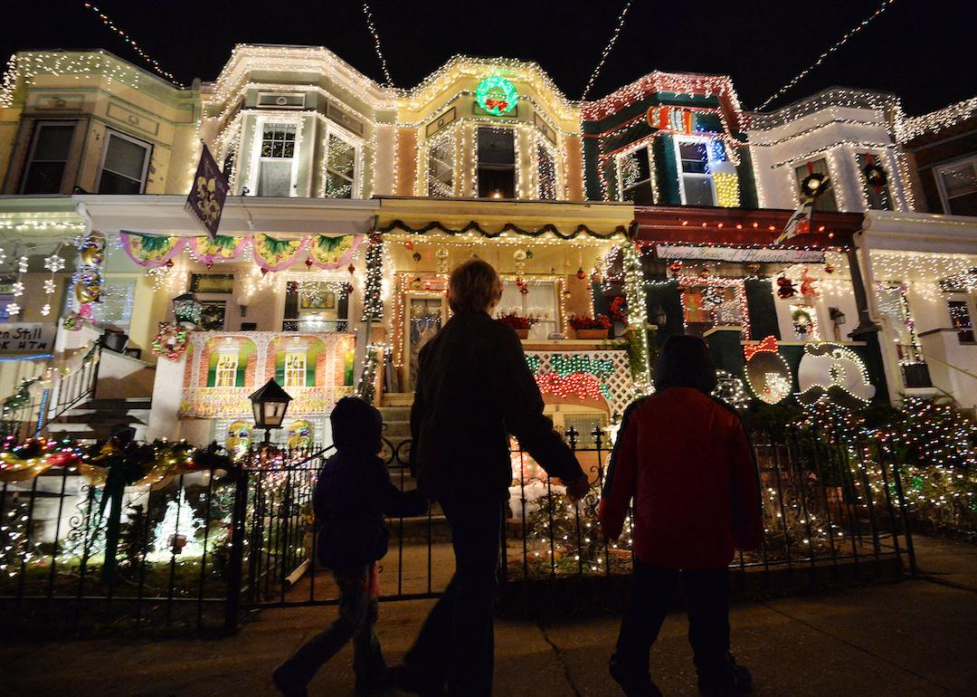 People enjoying the Christmas lights on the 700 block of 34th Street in the Hampden community of Baltimore, Maryland.