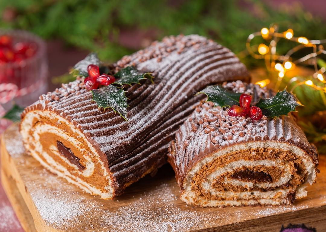 Traditional Christmas chocolate yule log with festive decorations.