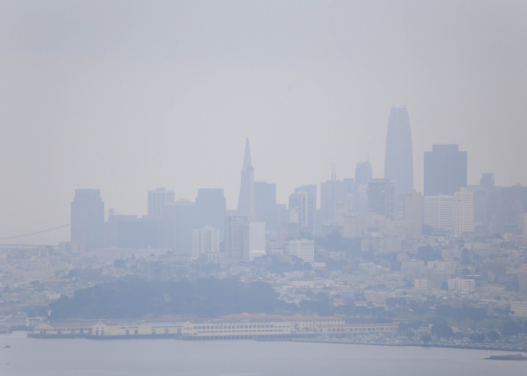 Smoke from wildfires causes hazy conditions over San Francisco skyline on sunny day