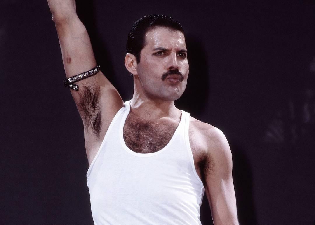 Freddie Mercury of Queen performs on stage at Live Aid at Wembley Stadium in July 1985 in London.