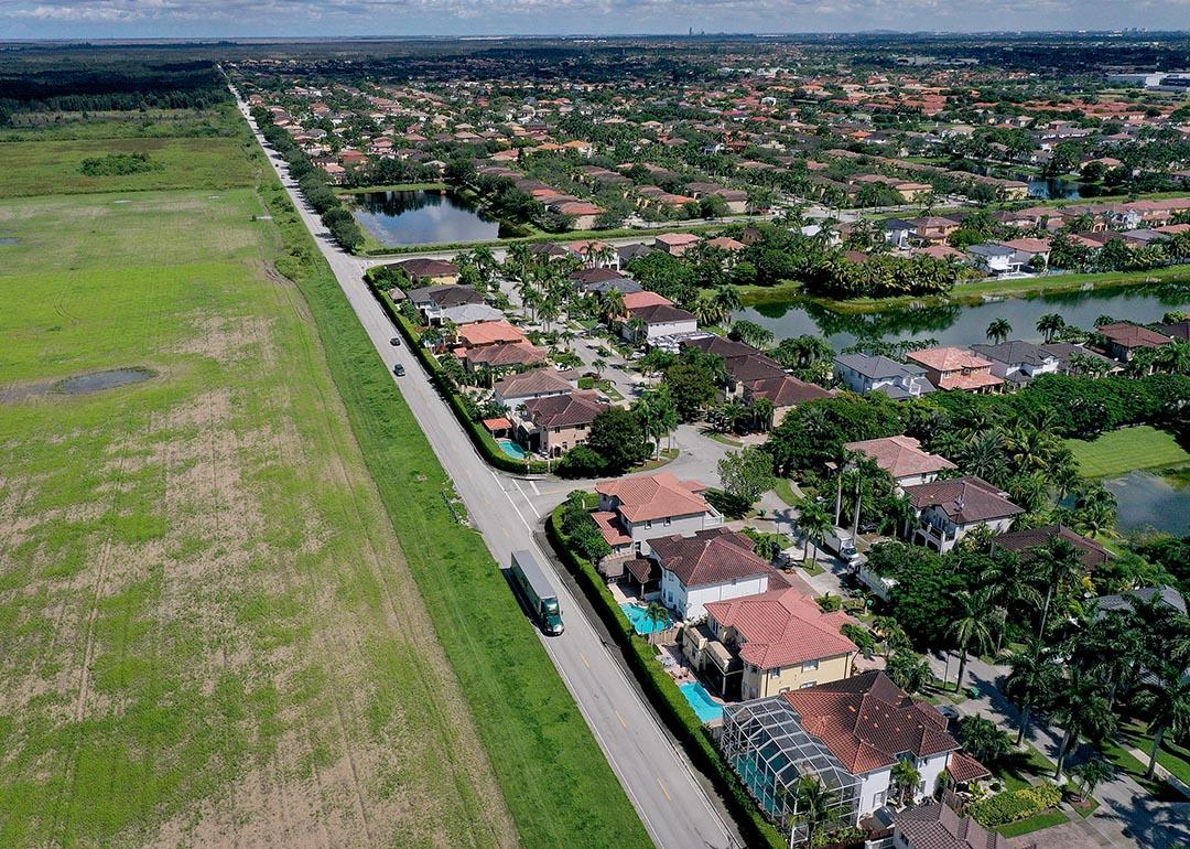 In an aerial view, urban sprawl along SW 157 avenue is nestled next to protected wetlands and farmland on the fringes of Everglades National Park.