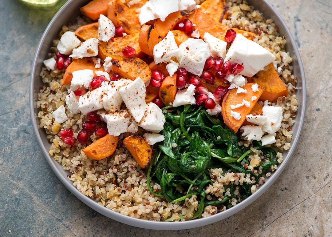 A plate of quinoa, feta cheese and sweet potatoes salad.