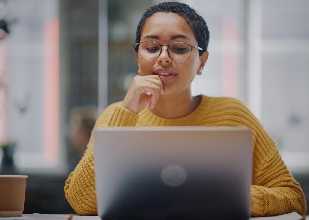 Person reading over email on their laptop.