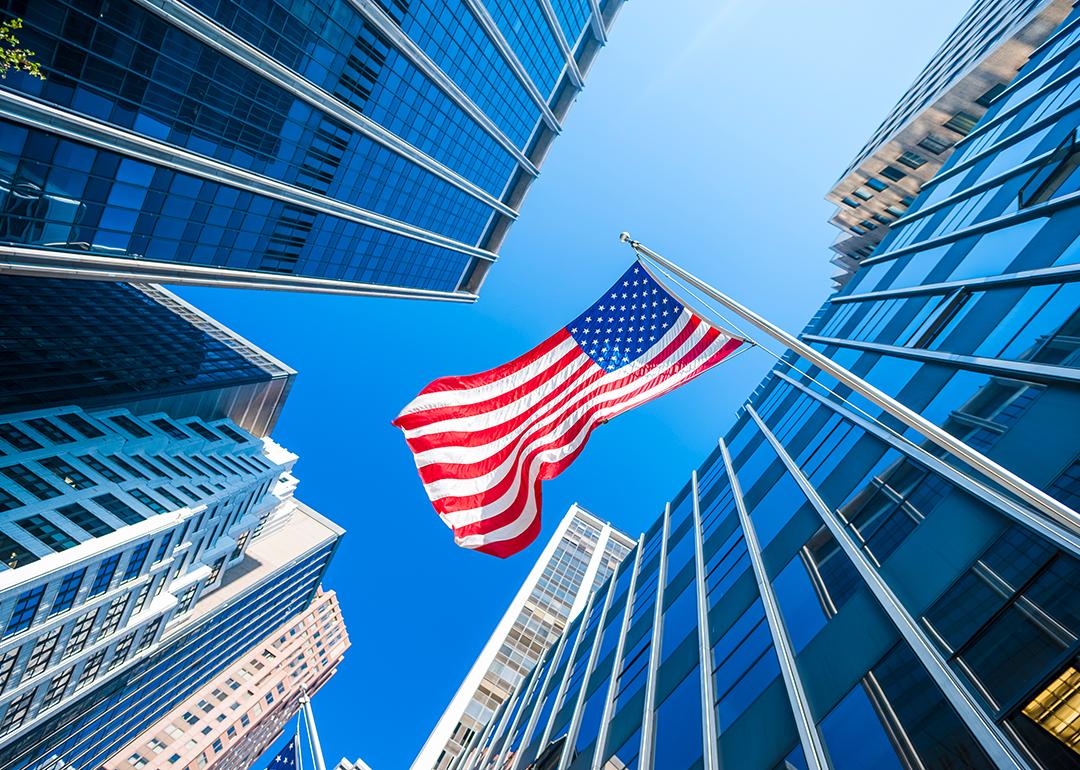 Business or finance district concept; modern buildings and the US flag.