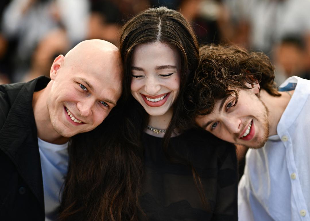 "Anora" stars Yuriy Borisov, Mikey Madison, and Mark Eydelshteyn pose at the Cannes Film Festival on May 22, 2024.