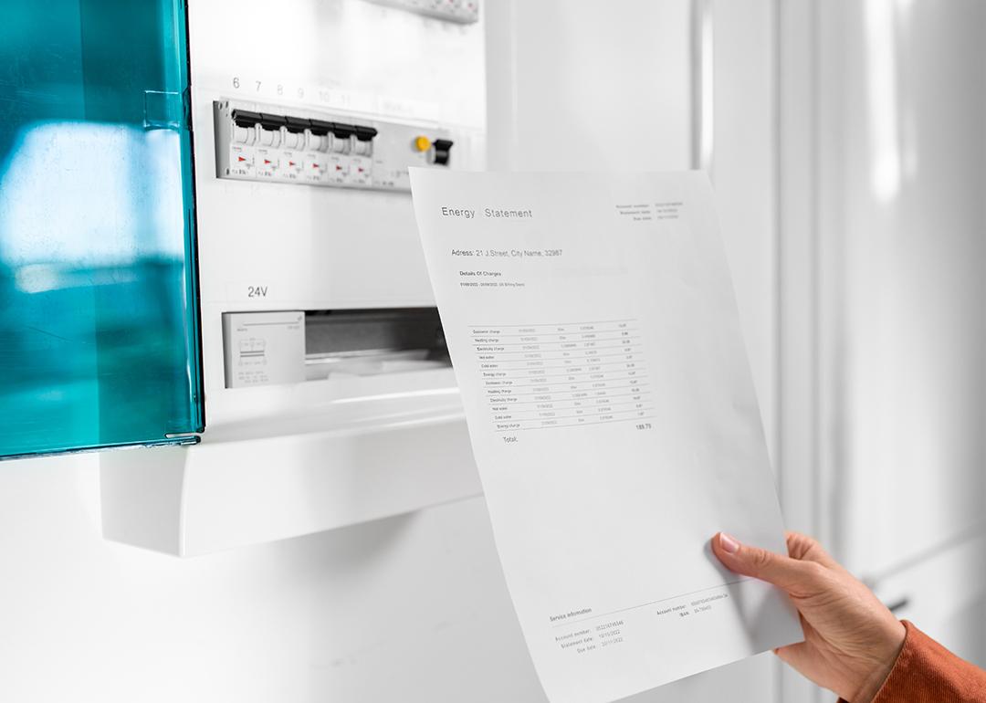 An energy statement held over a property's electric meter.