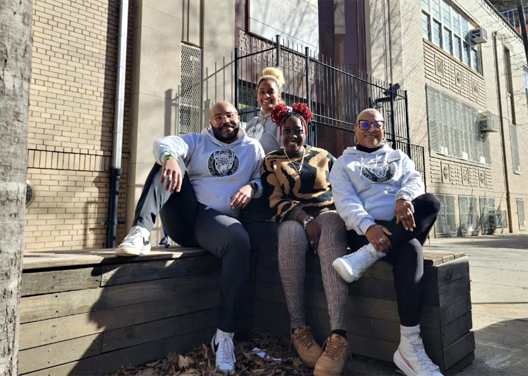 Malik Lewis, Sasha Fletcher, Shamella Jeffers, and Ingrid Roberts-Haynes pose for a photograph outside West Brooklyn Community High School in New York City.